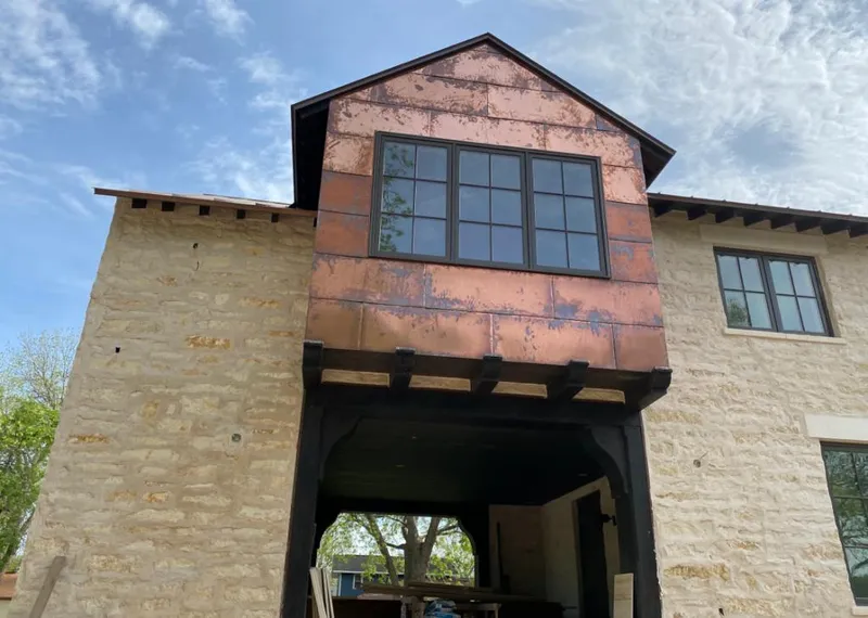 Copper metal panel facade on a stone building for Skylight Installation in Fort Knox